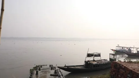 Stationery Indian boat seen while two boats pass by in Taki Stock Footage 170414866