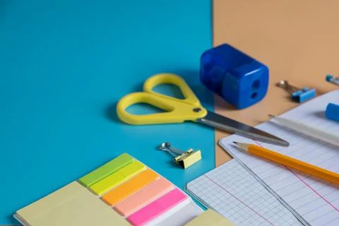 Stationery items. Colourful items for study and work in office on bright Stock-Fotos