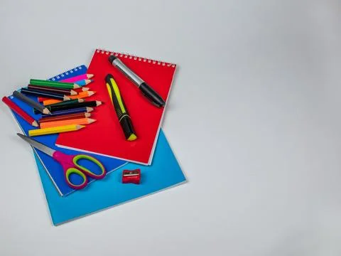 Stationery on light background, set of colored pencils for drawing, two markers Stock Photos