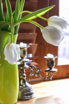 Stationery, a notebook, an extinct candle in a candlestick, and a bouquet of Stock Photos