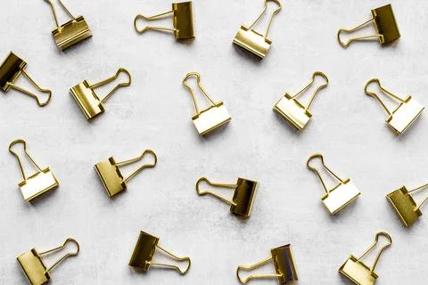Stationery pattern. Paper binder clips top view Stock Photos