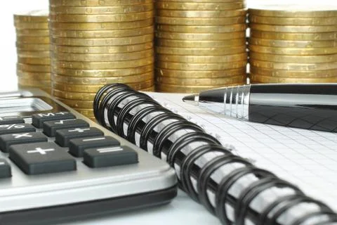 Stationery with stack of coins Foto stock