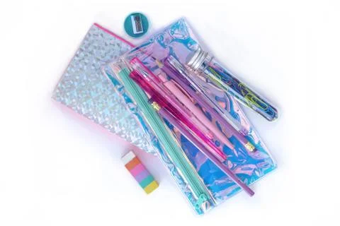 Stationery stack . Holographic notepad pencil case pen eraser clips sharpener. 스톡 사진
