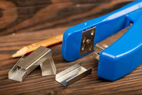 Stationery stapler, stapler staples, close-up, selective focus. Stock Photos