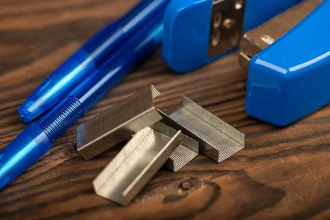 Stationery stapler, stapler staples, close-up, selective focus. Stock Photos