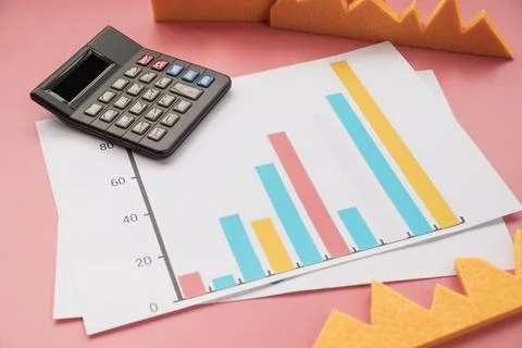 Statistic graphic with calculator Stock Photos