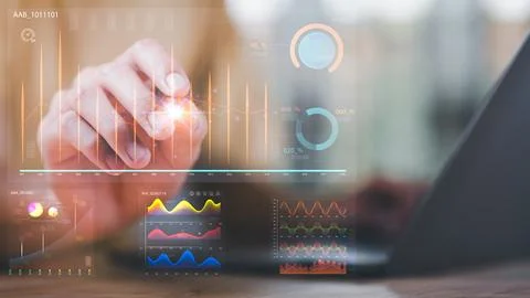 Statistical analyst reading graph report and business statistics charts ,An.. Stock Photos