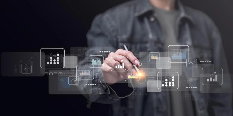 Statistical analyst using calculator to calculate and read reports, graphs .. Stock Photos