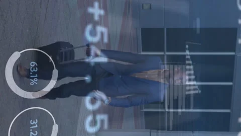 Statistical data processing against african american man with trolley bag Stock Footage 312438405