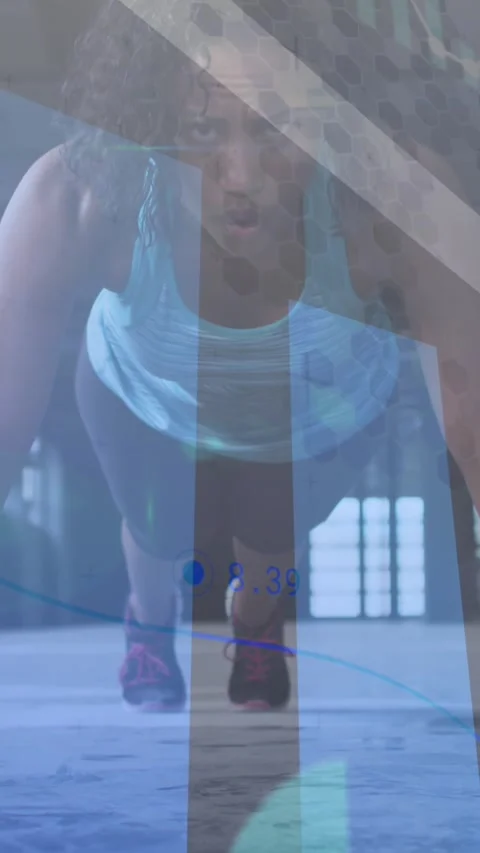 Statistical data processing against african american woman performing pushup 動画素材 323682524