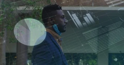 Statistical data processing against african american man with lowered face mask Foto stock