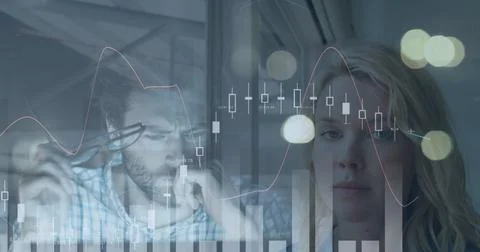 Statistical data processing against caucasian man and caucasian woman at office Stock Photos