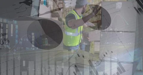 Statistical data processing against caucasian delivery man stacking boxes from 库存照片