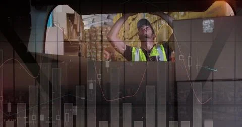 Statistical data processing against caucasian delivery man stacking boxes from Stock Photos