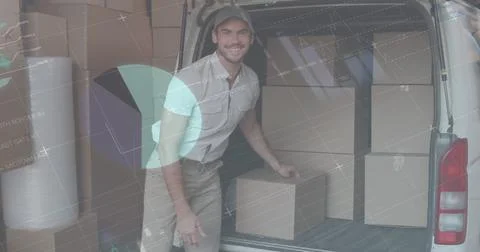 Statistical data processing against caucasian delivery man stacking boxes in his 库存照片