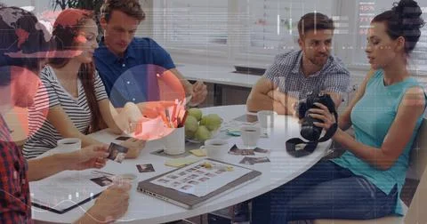 Statistical data processing against group of diverse office colleagues Stockfoto's