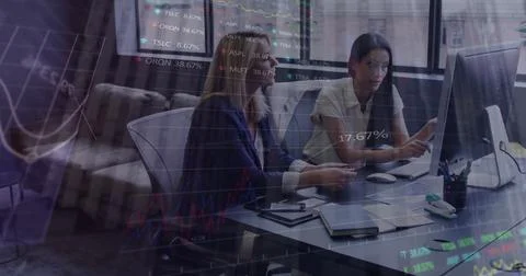 Statistical data processing against two diverse female office colleagues Stock Photos