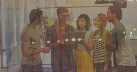 Statistical data processing and diverse office colleagues discussing over a Stock Photos