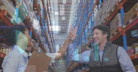 Statistical data processing over male and female supervisors high fiving each Stockfoto's