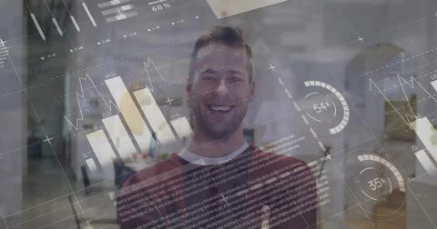 Statistical data processing over portrait of caucasian man smiling at office Stock Photos