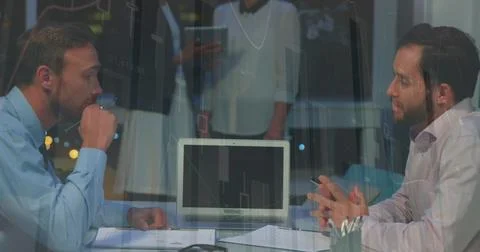 Statistical data processing over two caucasian businessmen shaking hands at Stock Photos