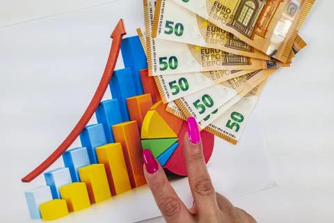 Statistics chart with 50 bills and woman hand making victory symbol 写真素材