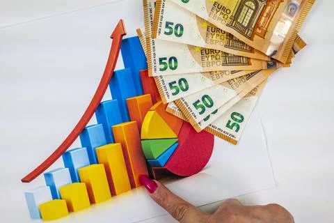 Statistics chart with 50 bills and woman hand pointing 写真素材