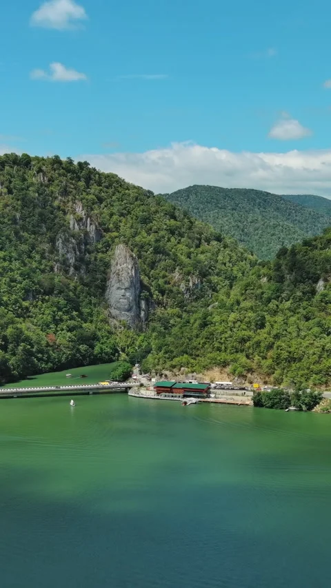 Statue of ancient dacian king Decebal on Danube river Stock Footage 346652229