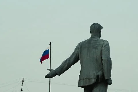 Statue and flag Stock-Fotos