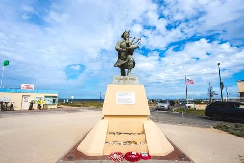 Statue and memorial for Piper Bill Millin. At Sword beach, normandy, France Stock Photos