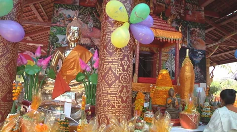 Statue and oblations in the monastery, Luang Prabang, Laos Stock Footage 55032856