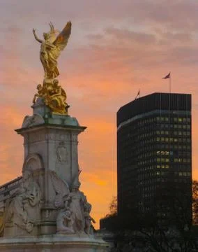 Statue and Skyscraper Stock Photos