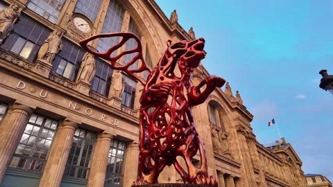 Statue of Angel Bear at Gare du Nord Station in Paris, France. Low-angle view Stock Footage 295600415