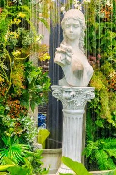 Statue of angel in cozy garden. Stock Photos