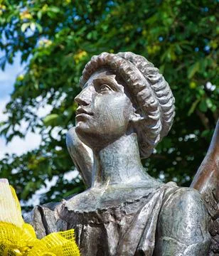 Statue of an angel in the park, close-up. Stock Photos