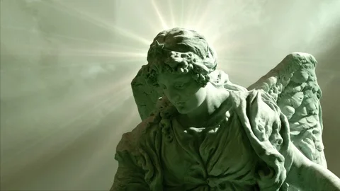 The Statue of an Angel on Time Lapse Clouds Stock Footage 85424547