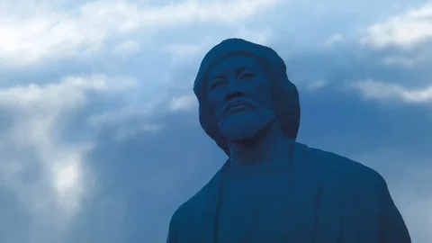 Statue on the background of running clouds. Stop motion Stock Footage