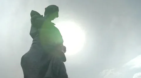 Statue Backlit with Sun Stockbeeldmateriaal 54181373
