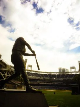 Statue of Baseball Player against beautiful sky Stock Photos
