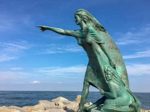 A statue at a beach in venice Stock Photos