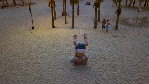 Statue of Ben Gurion doing yoga at the Tel Aviv beach, Israel, aerial 4k Video stock 125419585