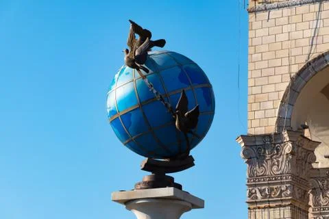 A Statue Of A Blue Terrestrial Globe With Doves Of Peace Around It In Kiev Stock Photos