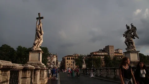 Statue at the bot side of the bridge, gloomy weather and people walking, Italy Stock Footage 95635832