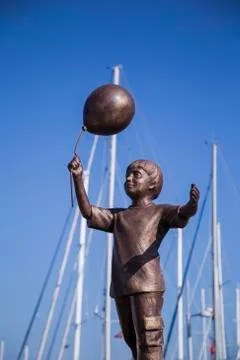 Statue of a boy with a balloon Stock Photos