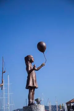 Statue of a boy with a balloon Stock Photos