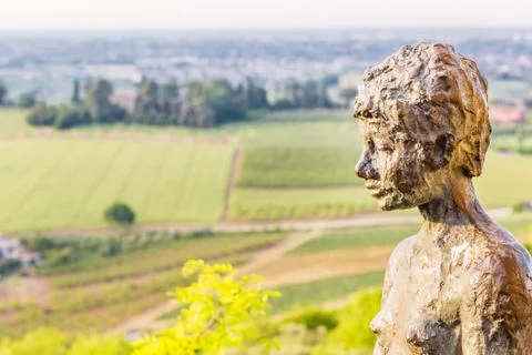 The statue of the boy sitting in Longiano Stock Photos