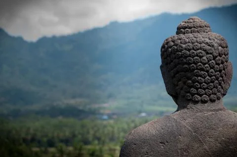 Statue Buddha Facing the Mountains Stock Photos