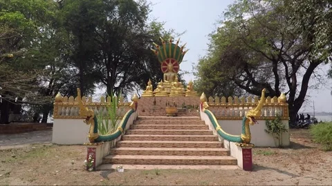 Statue of Buddha with Naga in front of the temple in Savannakhet, Laos Stock Footage 145720307