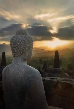 Statue of Buddha at sunset, Borobudur, Java, Indonesia Stock Photos
