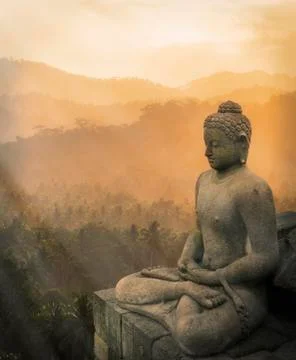 Statue of Buddha at sunset, Borobudur, Java, Indonesia 스톡 사진